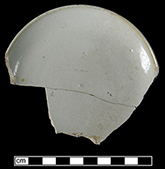 Saucer with brown iron oxide exterior rim glazing from 18CV60.